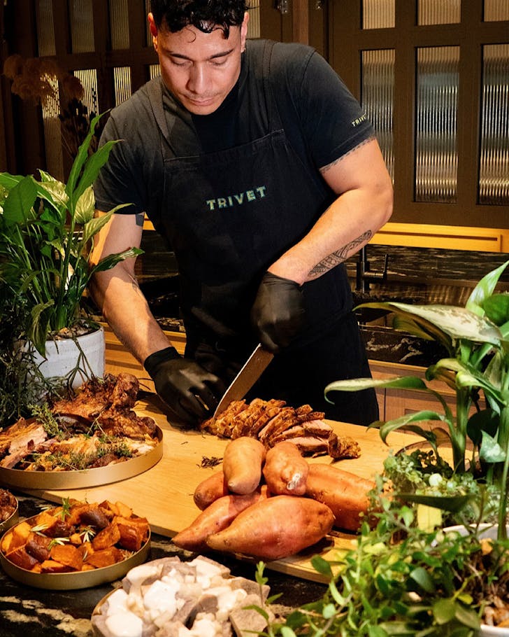 Chef Wallace carves up the meat at the Matariki themed buffet at Trivet