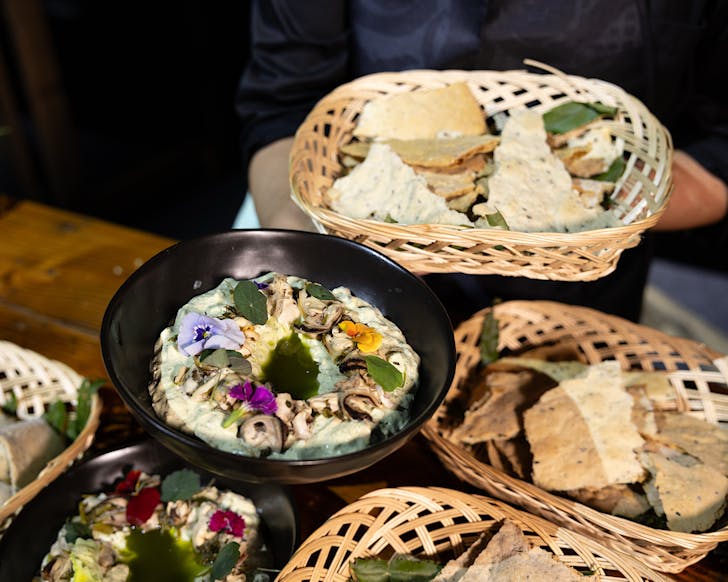 Plates and baskets of kai to promote the Tohunga Tumau: Puanga Matariki Dinner 