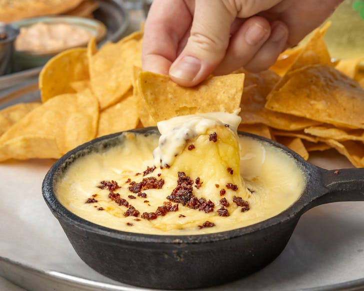 A cheesy tortilla dip at Churlyâs Brewpub