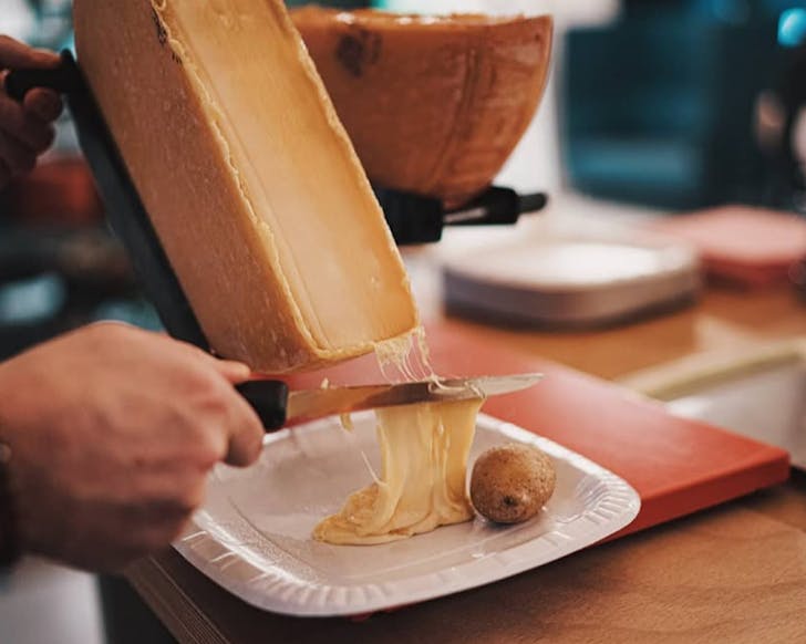 Raclette cheese oozes over on serving by Le MarchÃ© FranÃ§ais in Wellington