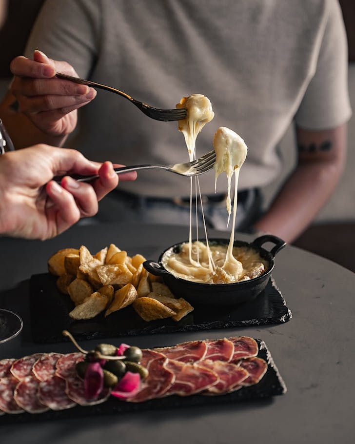 Raclette cheese pull at Atelier on KâRoad