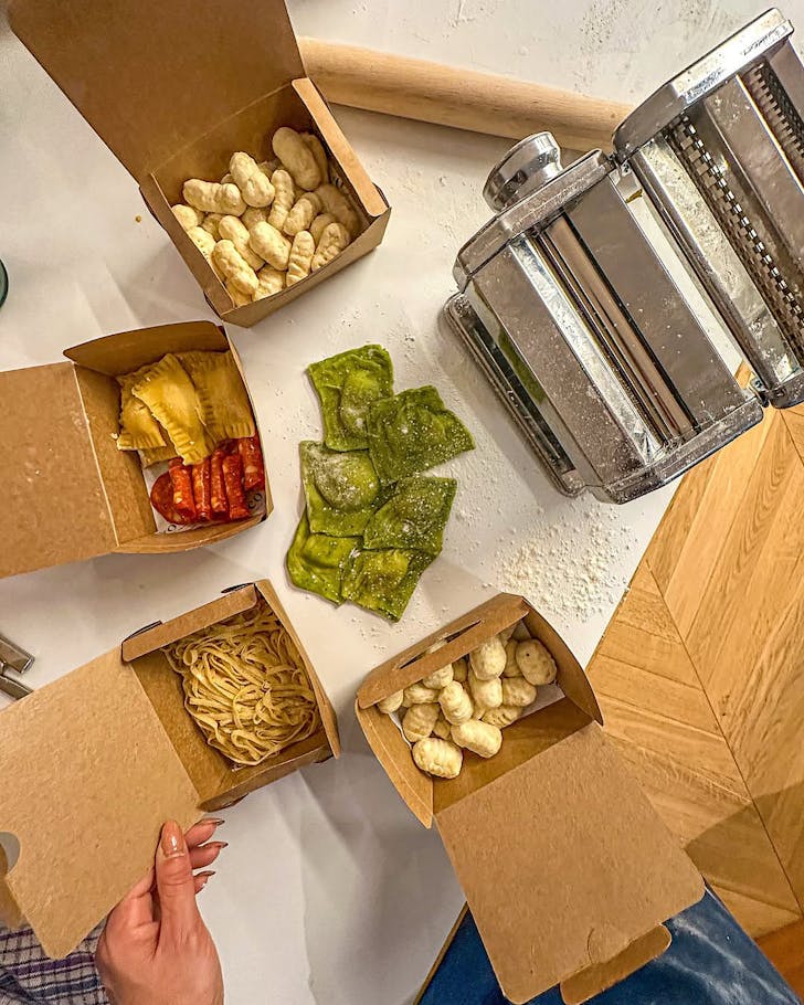 Pasta Masterclass attendees are ready to take boxes of their fresh pasta home.