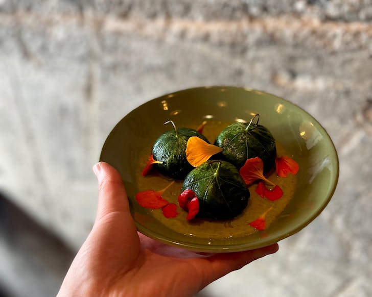 Graze Wine Bar signature tamales with nasturtium leaves in PÅneke