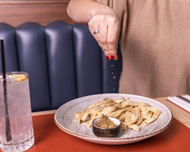 Parmesan cheese bae over fresh pasta at Bar Albert / voco Aucklandâs pasta masterclass