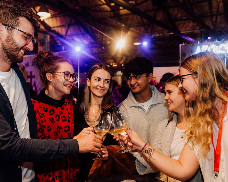 Group of people enjoying wine at Winetopia 