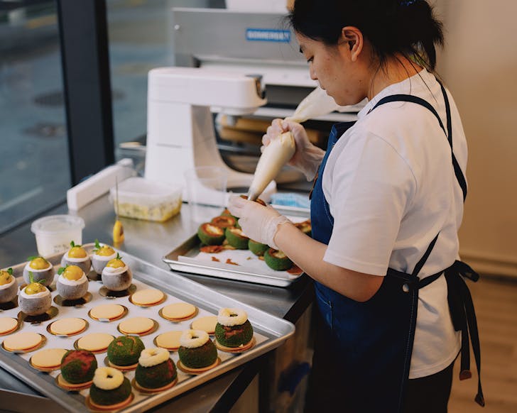 Jocelyn assembles delicious petit gÃ¢teau at her patisserie shop, April Patisserie in Wellington