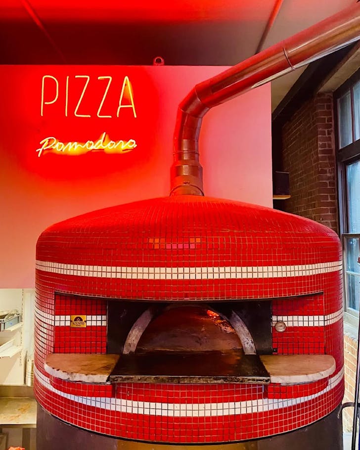 Iconic red oven at Pizza Pomodoro in PÅneke (Wellington)