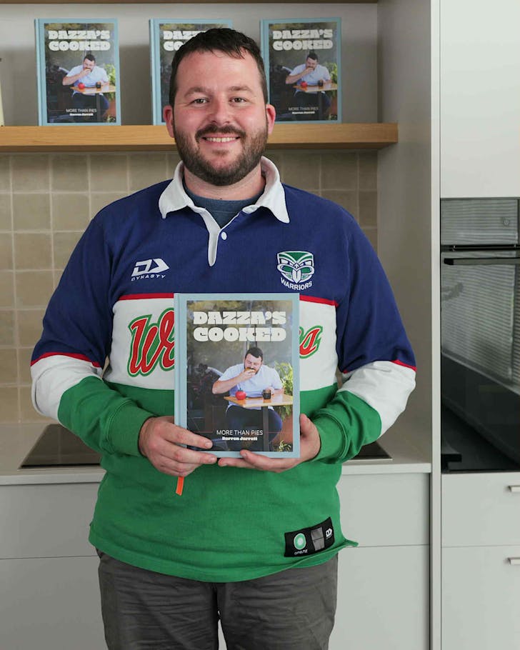 Darren Jarret with his new cookbook, Dazzaâs Cooked