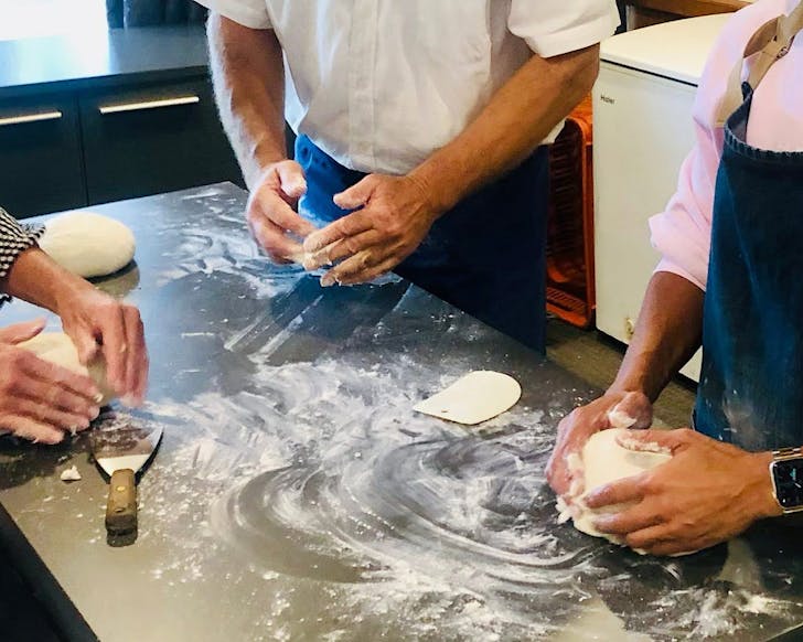 Hands making sourdough at Salt & Sugar Sourdough classes in Auckland