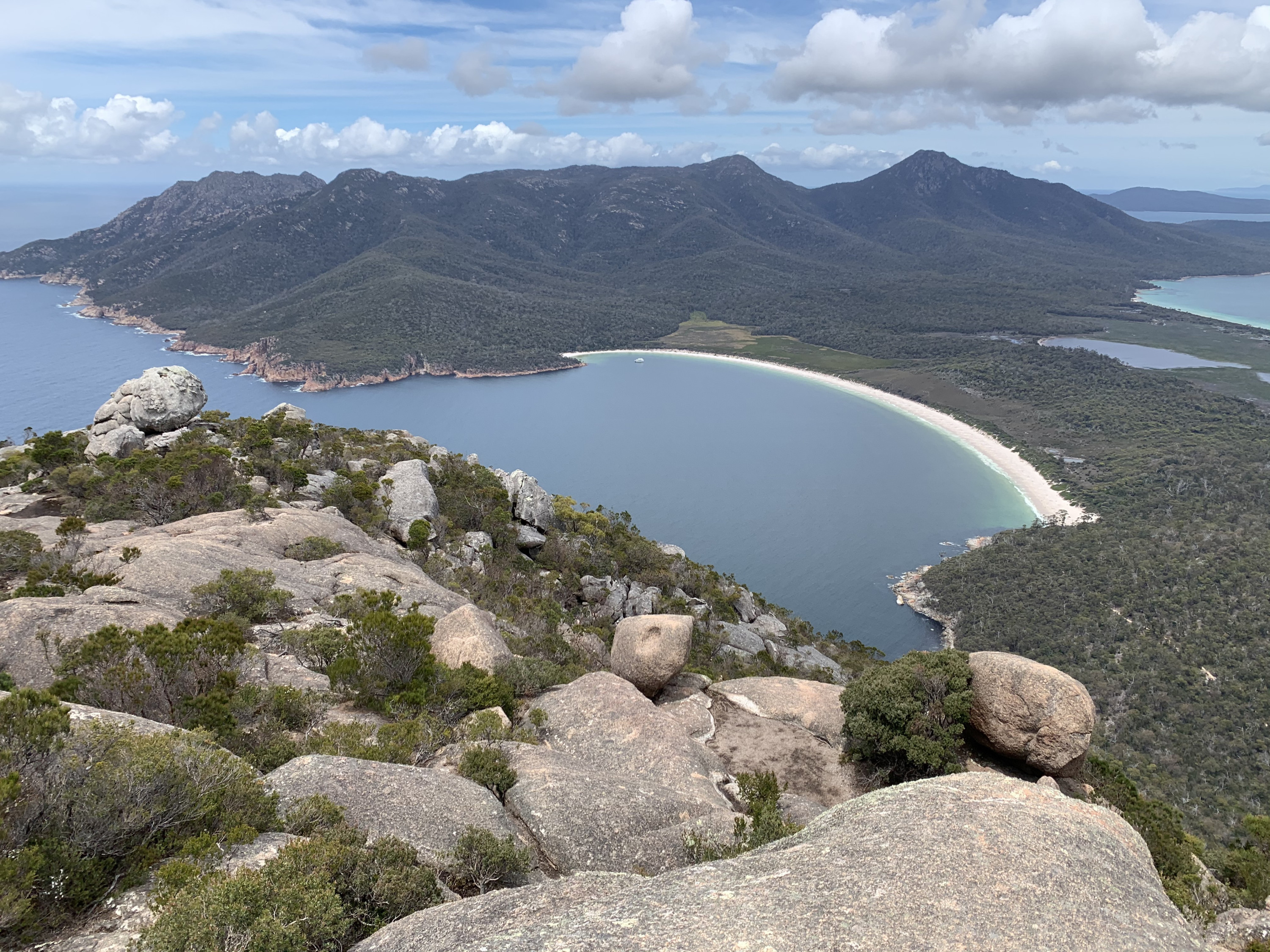 a view of a beautiful bay from the top of a mountain