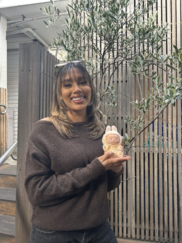 Influencer Doreen Daniel holding a Labubu.
