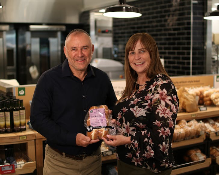 Woolworths and Kidscan photo with 2026 Hot Cross Buns