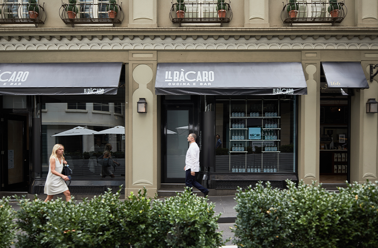 Two people walking past one of the best restaurants Melbourne has to offer, Il Bacaro