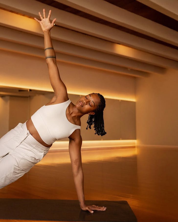 Imani teaches a yoga class at Kenko Studios, one of Auckland's best yoga studios. 