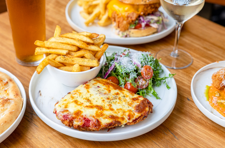A monster parma served with chips and salad at The Imperial Hotel