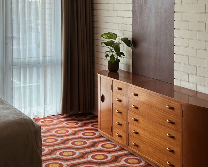 A retro style room with orange carpet at Indian Ocean Hotel one of the motels in Australia