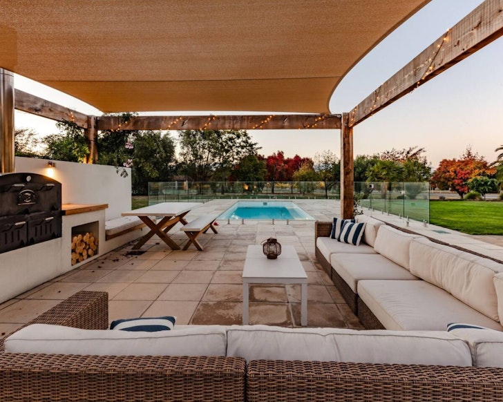 The outdoor entertaining zone and pool at Indulge in Luxury best family friendly accommodation New Zeland