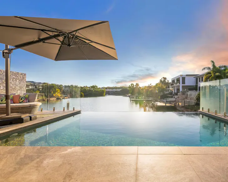 A view across the infinity pool to the marina at Infinity's Edge one of the best Darwin Airbnbs