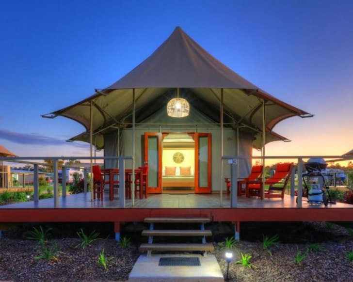 A tent with red doors at Ingenia Holidays Rivershore one of the best glamping spots in Queensland