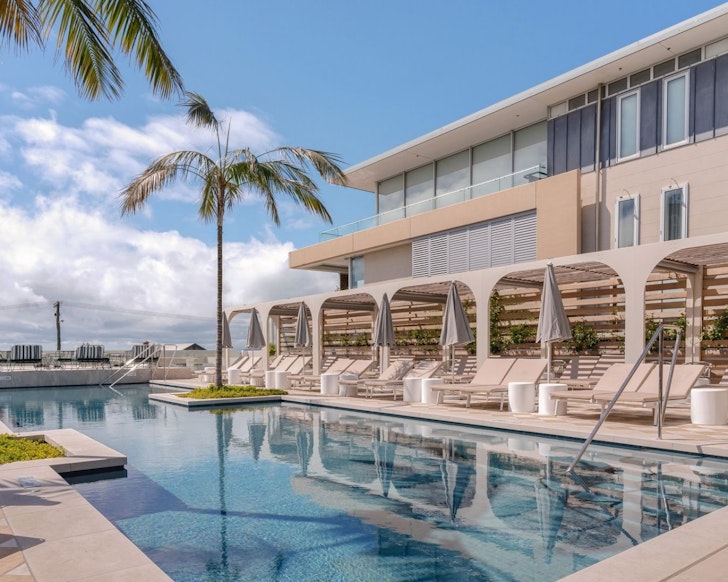 A view of the pool with hotel in the background at InterContinental Sorrento one of the best hotels in Australia