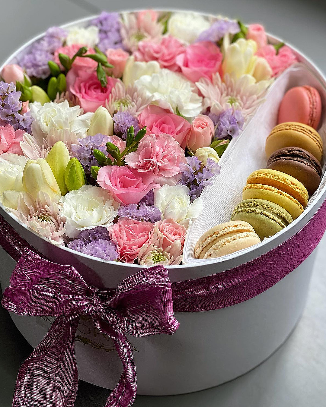 Flowers with a little side of macarons from Istoria.