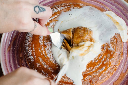 We cut into a giant stack of pancakes dripping in cream and Biscoff butter.