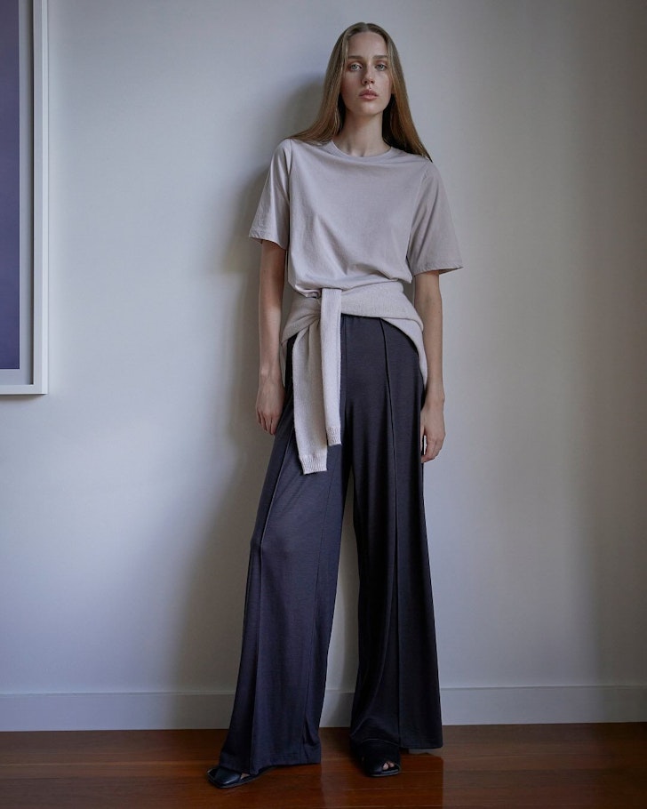A woman wears a casual outfit by Jack + Jack one of the best Australian fashion labels