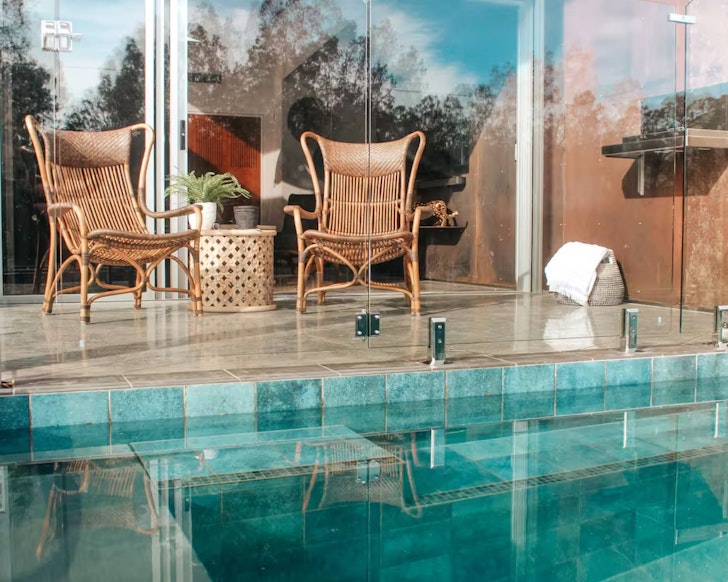 Chairs by the plunge pool at Jaguar Stay Airbnb one of the best accommodation options near Batemans Bay