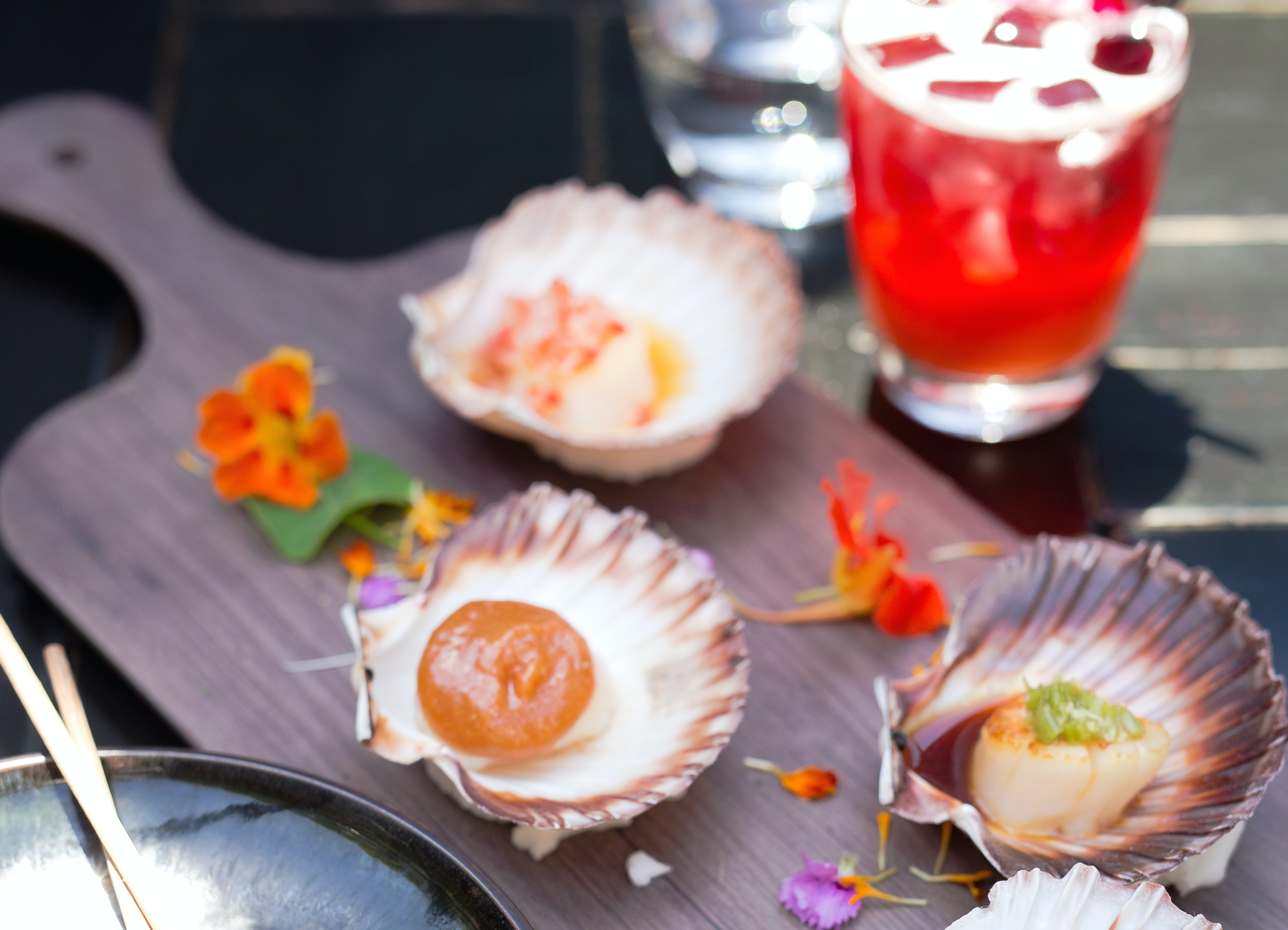 A wooden board with scallops on it. A top things to do Melbourne.
