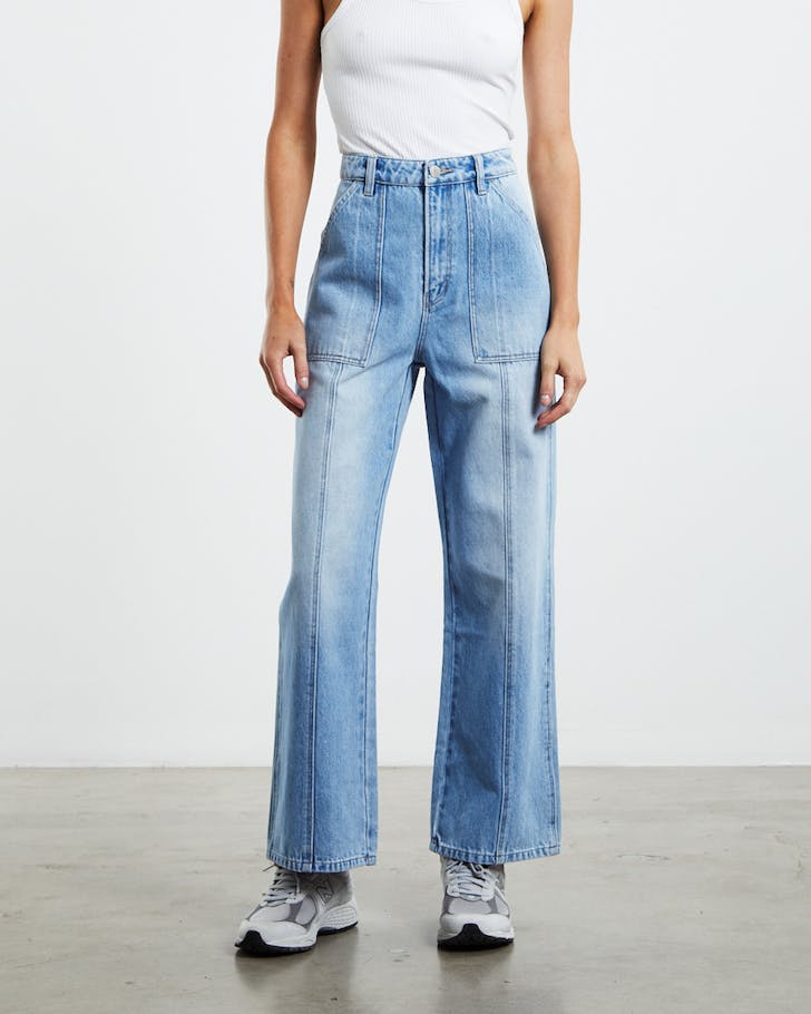 Half image of woman in light blue jeans