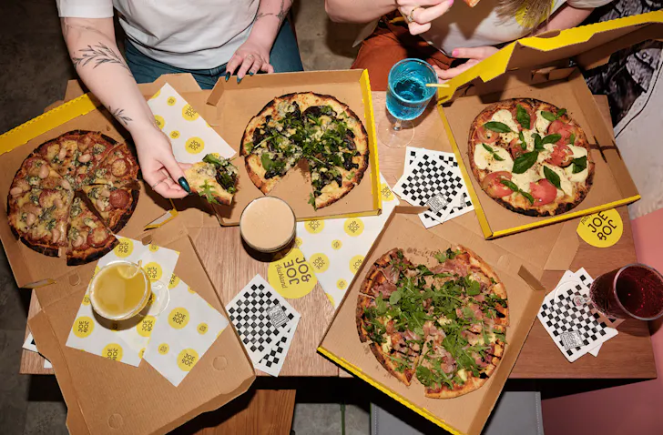 Friends tuck into a pizza haul at Jo&Joe;
