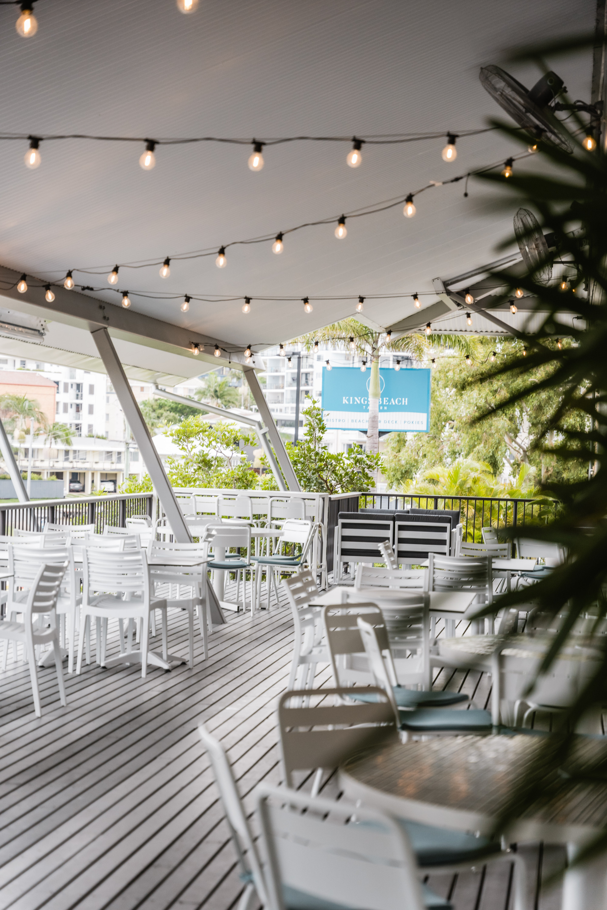 kings beach tavern's white outdoor deck with fairy lights