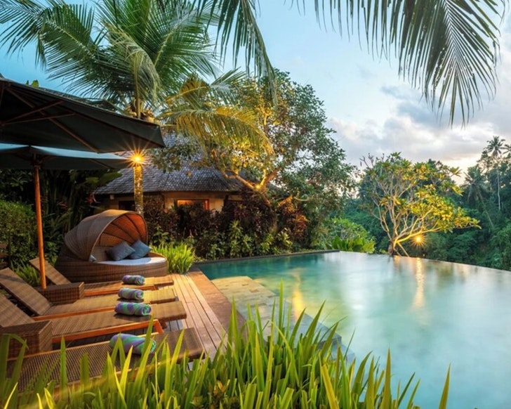 A view of the infinity pool looking out over the jungle at Kadewa Retreat Ubud one of the best adults-only resorts Bali