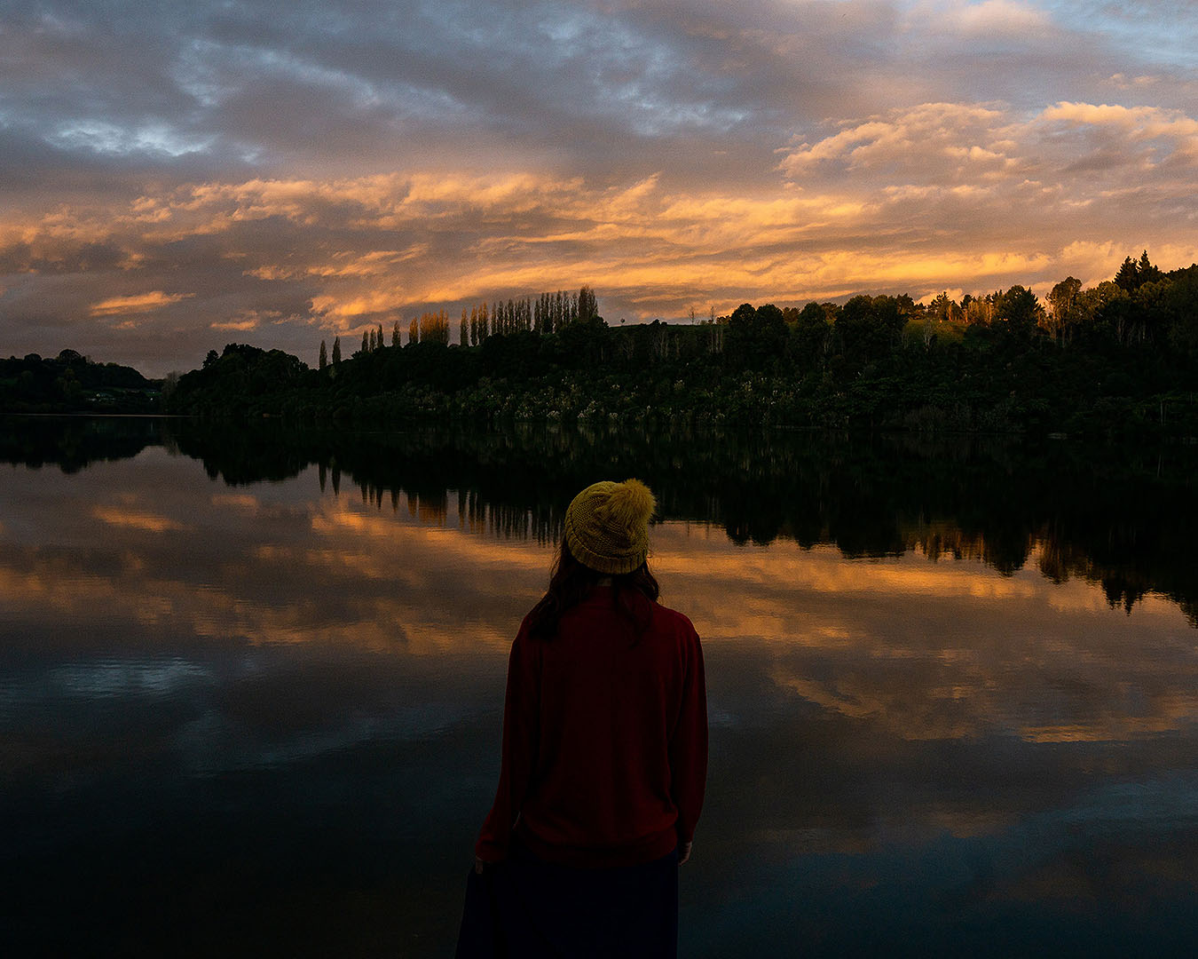 The author stands on the edge of Lake Karapiro, one of the best places to catch a Waikato sunrise.