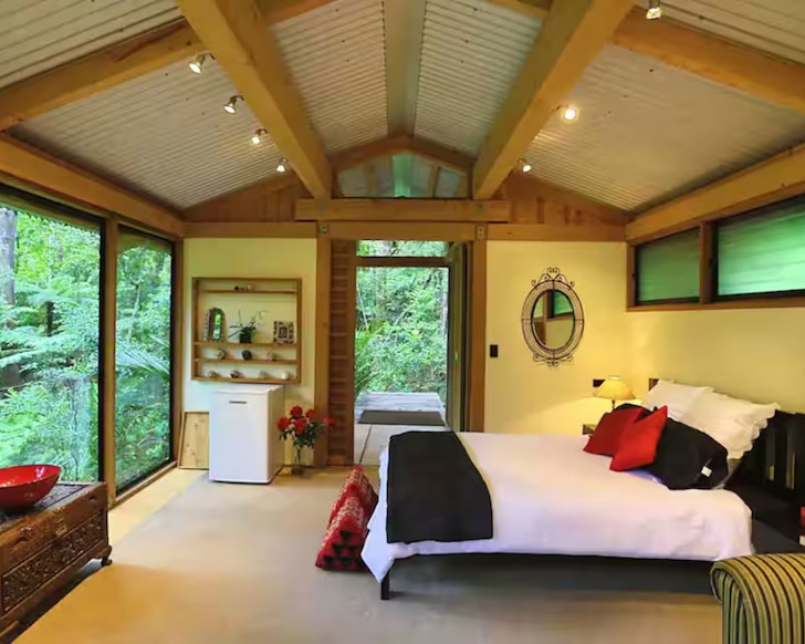 The cosy interior of Kauri Forest Chalet one of the best Auckland Airbnbs