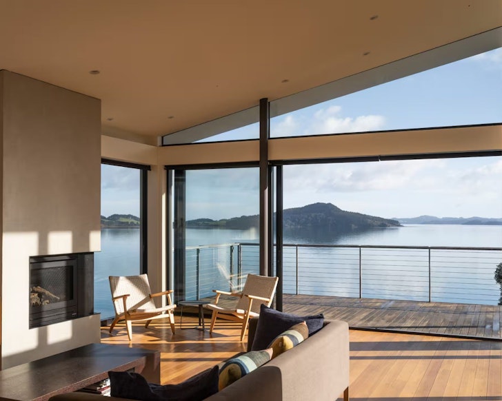 The balcony with a water view at Kawakawa Bay Haven best large group Airbnbs New Zealand
