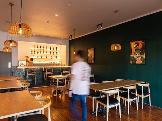 Alex walks down the Khu Khu Milford restaurant.