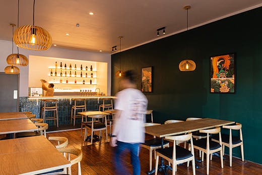 Alex walks down the Khu Khu Milford restaurant.