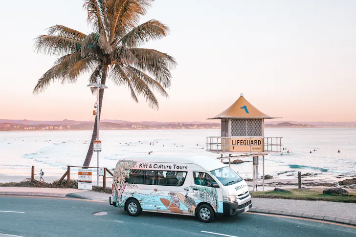 a van against a beautiful beach backdrop