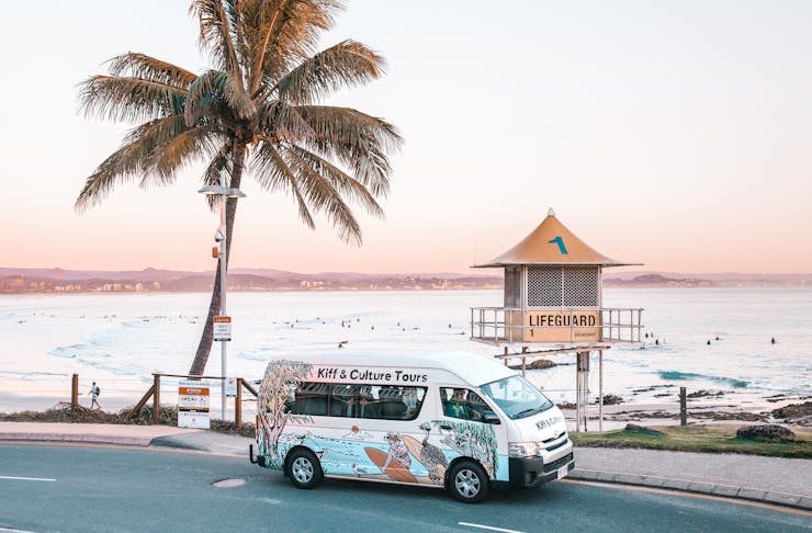 a van against a beautiful beach backdrop
