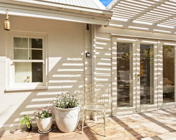 The white exterior of Kilara Cottage one of the best Phillip Island Airbnbs