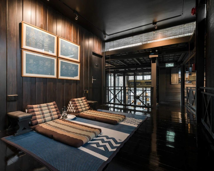 A wood-panelled room at Kloem Hostel one of the best Bangkok hotels