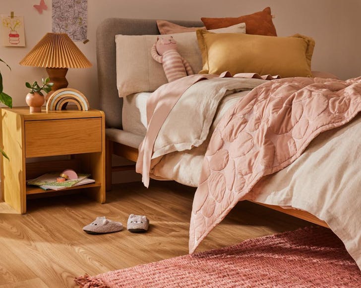 A Koala mattress with a blush pink duvet