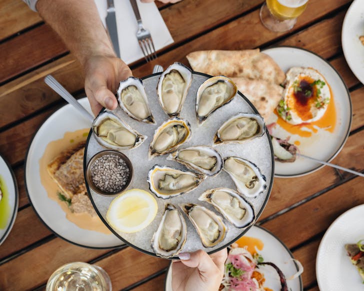 Two plates holding oysters