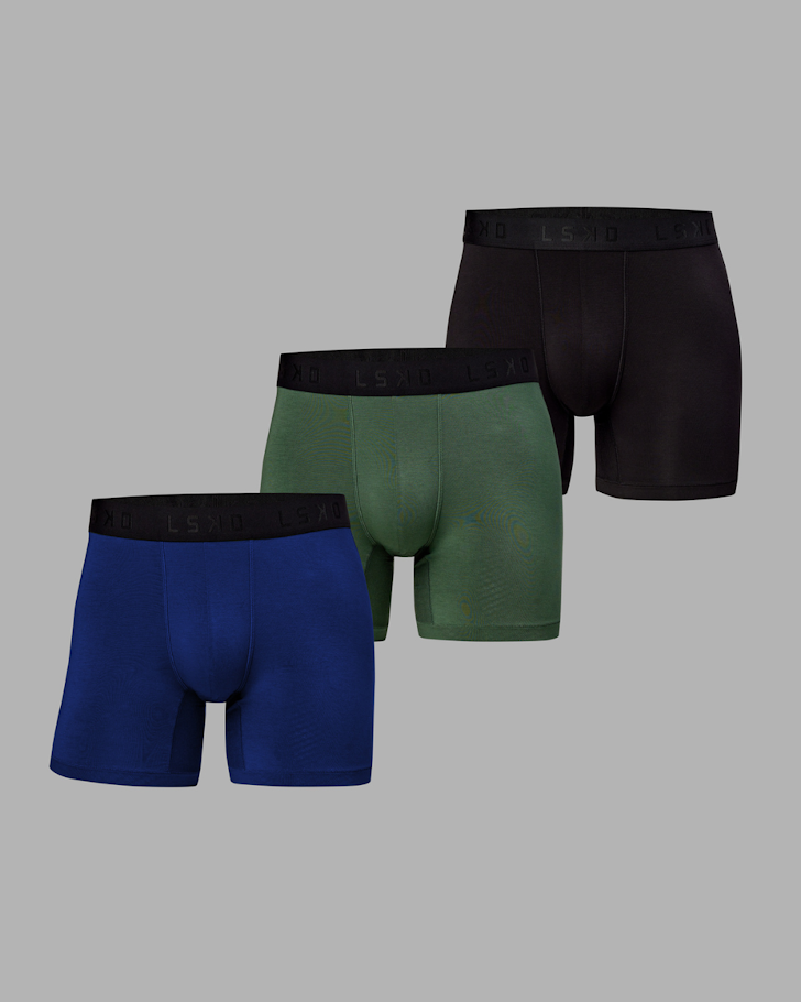 Three pairs of LSKD trunks in dark scarlet/black, green and blue.