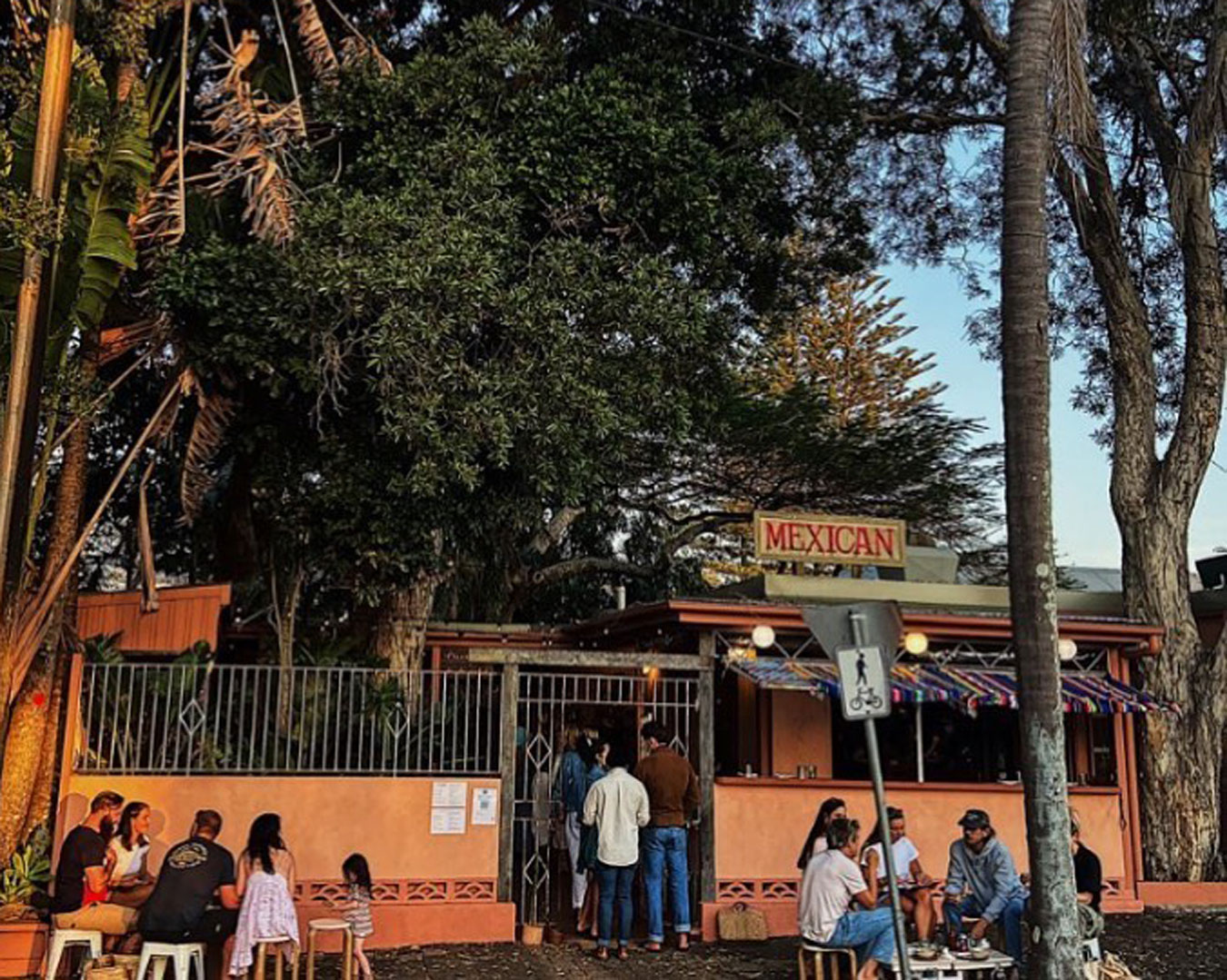 exterior of restaurant with people out front