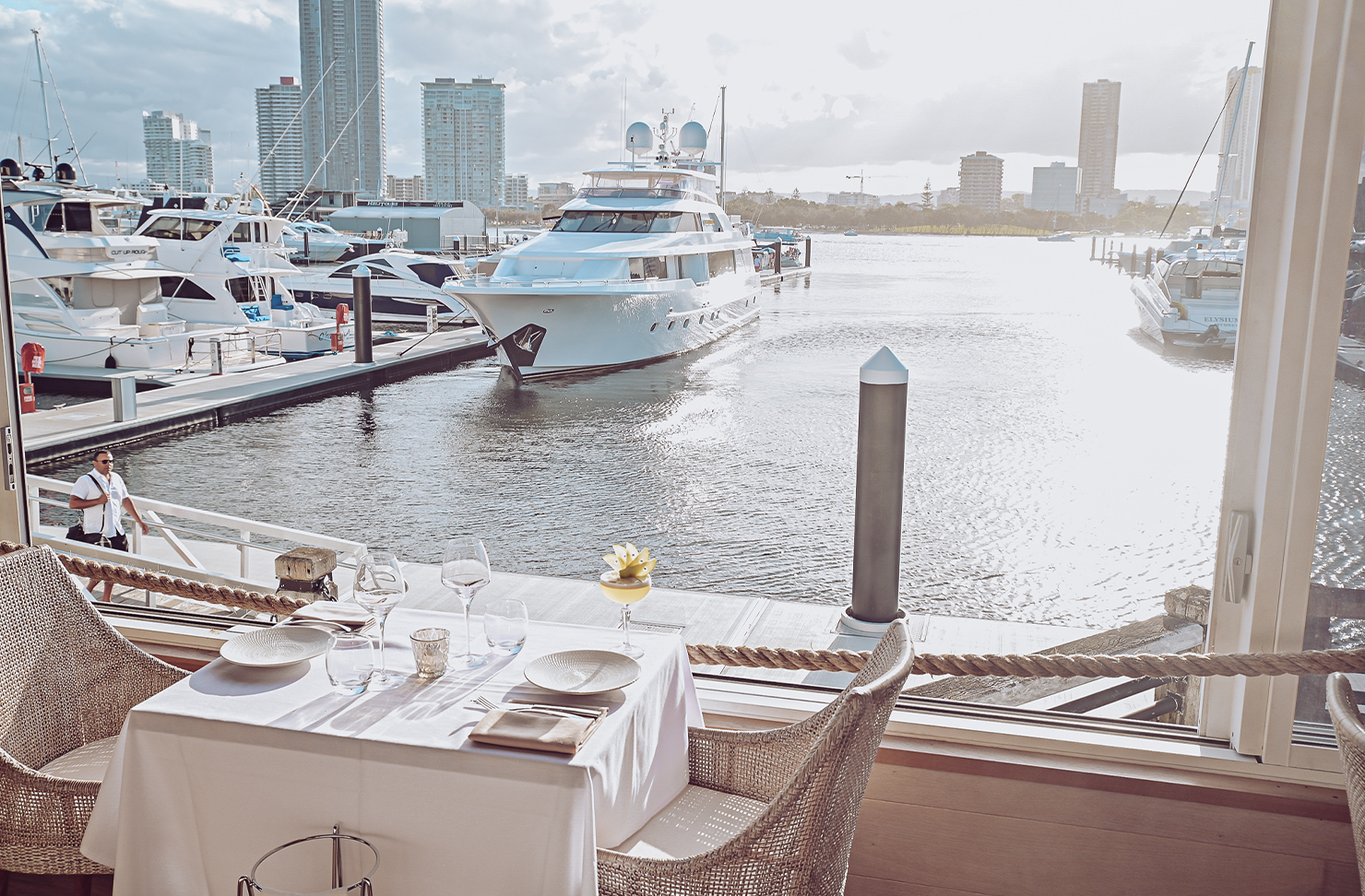 a restaurant view looking over the broadwater at sunset
