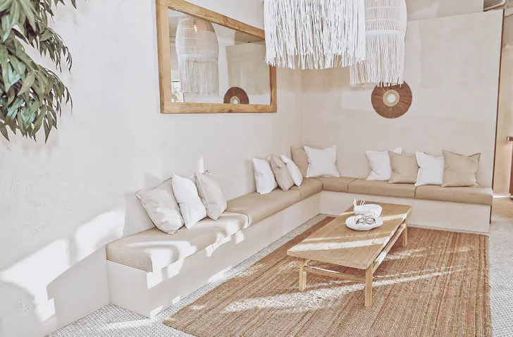 an interior shot of a neutral-coloured lounge area
