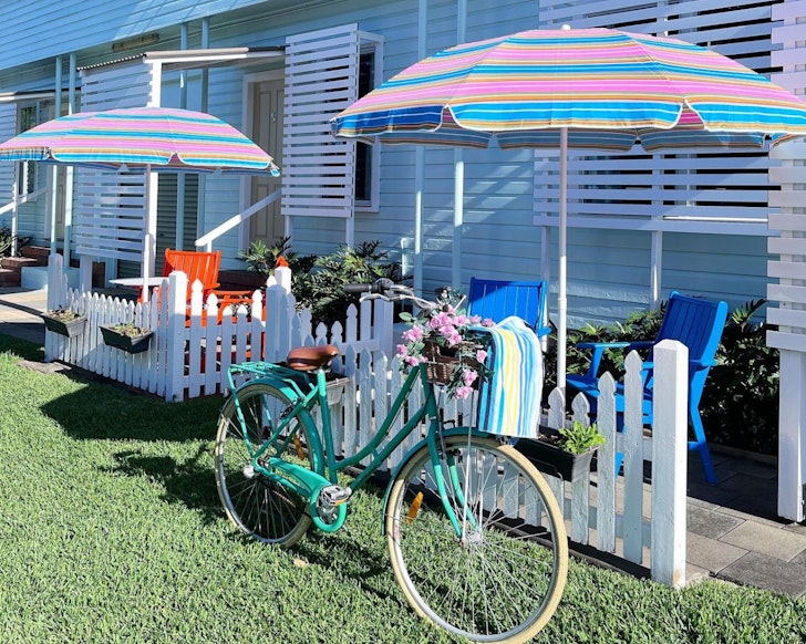 A vintage bike sits outside a room at La Costa Beachside Motel one of the best motels in Australia