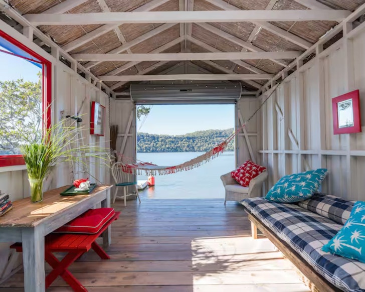 A view of the hammock in the boatshed overlooking the water at La Riveraine Airbnb one of the best romantic getaways in Australia
